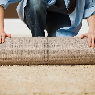 Woman Rolling Carpet